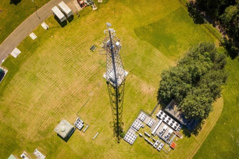 A radio tower with surrounding facilities and a road seen from above, Bunker Anlage, Calw, Germany