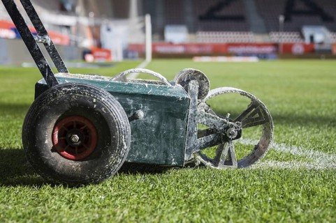Line painting trolley on a soccer field