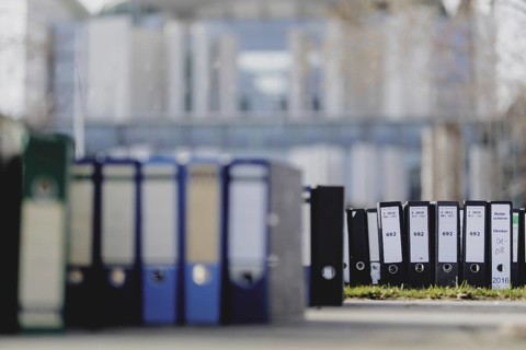 File folders stand in front of the Federal Chancellery as part of a protest action by the German