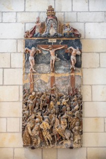 Late medieval Passion altarpiece as a stone wall relief with sculptured, biblical figures in the