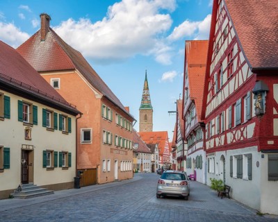 Alley with half-timbered houses and cobblestones in the old town centre in the evening, behind the