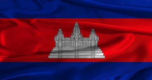 Flag of Cambodia with fabric textured background. Close up of National flag of Cambodia with