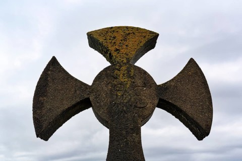 Celtic cross against grey background, sky, Kilcatherine Cemetery, Ring of Beara coastal road, Beara