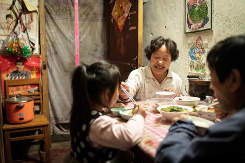 Gao Jian Min (67), Lin Shu Xiang (56) and Gao Xin Rui (5) having dinner, the grandmother bought
