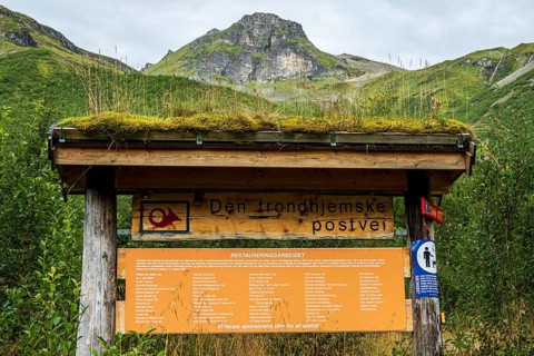 Explanatory board describing the historic Trondheim Postal Road, near Hellesylt, Norway