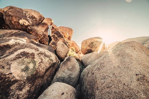 Woman hiking at sunrise in Joshua Tree National Park