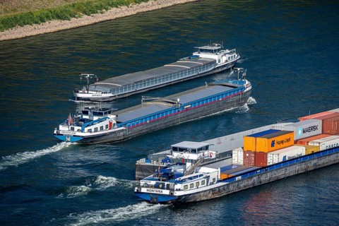 The Rhine near Oberwesel in the UNESCO World Heritage Upper Middle Rhine Valley, cargo ships on the