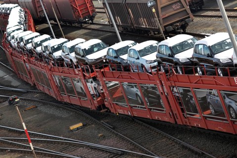Wolfsburg, DEU, 250211 - Car transport wagons with new Volkswagen Golf and Tiguan vehicles on the