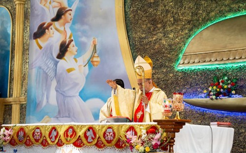 Archbishop John Moolachira leads a prayer during a Christmas day sermon on December 25, 2024 in