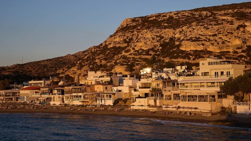 Coastal view with houses and hills, quiet atmosphere at sunset, Matala, South Coast, Crete, Greek