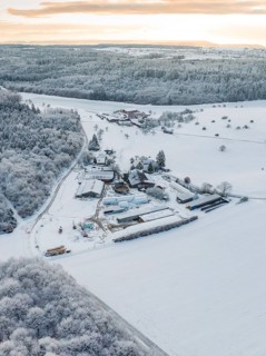 Panoramic view of a snow-covered landscape with forest and buildings, Haselstaller Hof, Calw