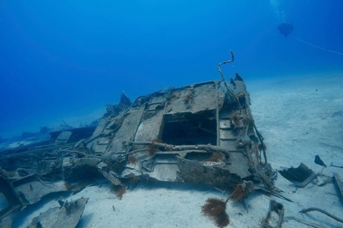 Worn out part of shipwreck lies on the sandy seabed, meteor wreck dive site, Russian hydrofoil,