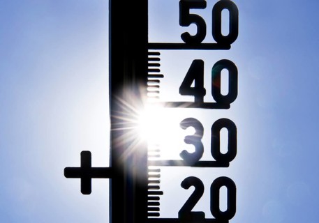 Thermometer shows heat in blazing sun and cloudless sky, symbolic image, summer 2026, Witten, North