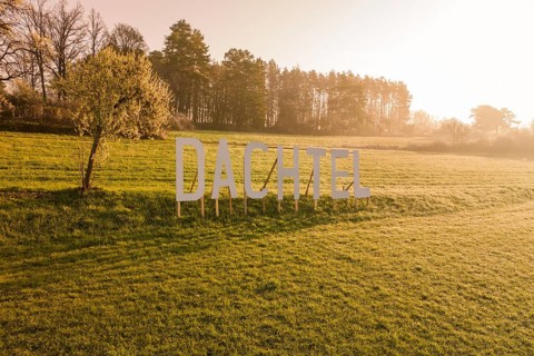 Landscape with large letters and trees in a meadow in sunlight, Dachtel, Aidlingen, Heckengäu
