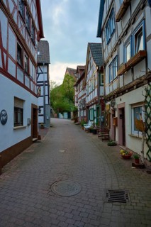 Narrow street with traditional half-timbered houses and a cozy atmosphere, spa town of Bad Orb,