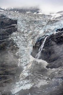 Glacier tongue of the Grindelwald-Fiescherfirn glacier with waterfall, Bernese Alps, Bernese