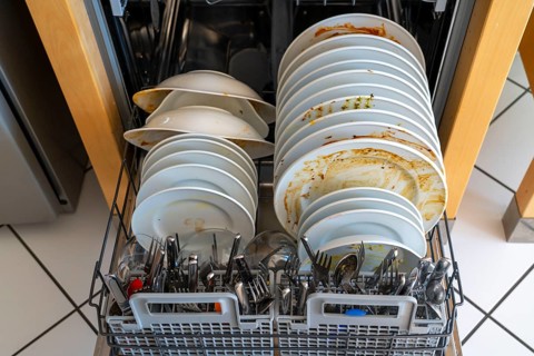 Dishwasher, full of dirty crockery