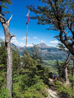 Chilean flag, flagpole, viewpoint Mirador La Bandera, above village Villa O' Higgins, Patagonia,