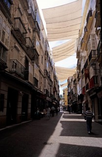 Large tarpaulins to provide shade for a street in the city centre of Cádiz, Spain