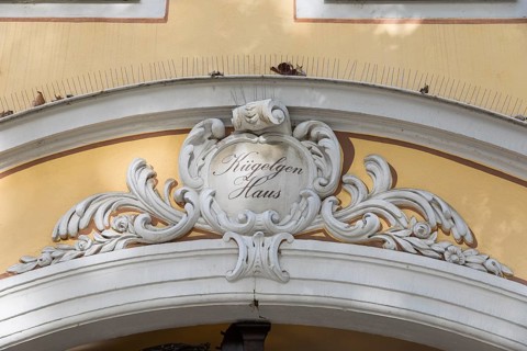 Detail on the portal with baroque decoration and Kügelgen House lettering, entrance to the Kügelgen
