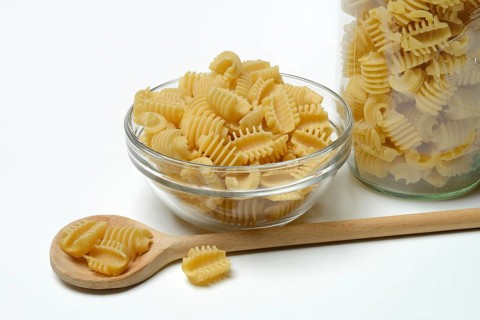 Italian pasta in a glass bowl, Radiatori variety