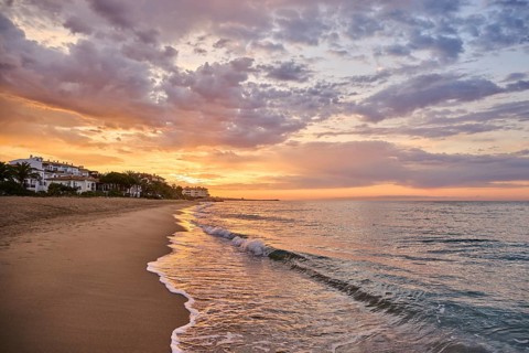 Sunrise with morning colors on a sandy beach near Tarragona, Catalonia, Spain