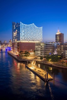 Aerial view of sunrise on the Elbe with Elbe Philharmonic Hall and reflections in the glass façade,