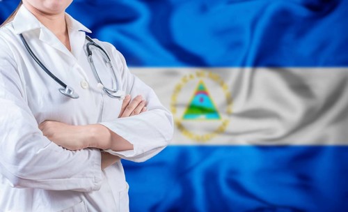 Doctor with stethoscope on Nicaraguan flag. Nicaragua Health and Care concept. Doctor with crossed