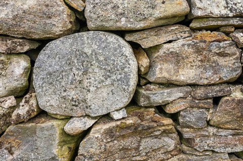 Field stones in a house wall of an abandoned courtyard in Scotland, Aviemore, Scotland, Great