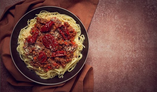 Spaghetti bolognese, with dried tomatoes, homemade, close-up