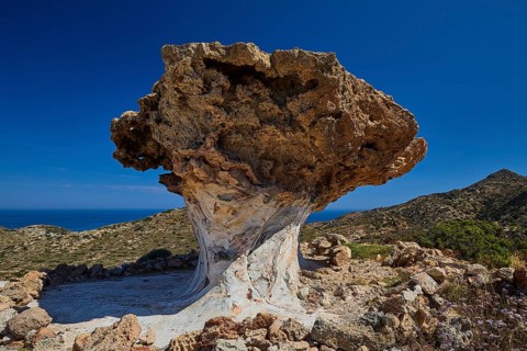 Majestic rock formation against vast sky and mountain scenery, mushroom rocks, mushroom rock,