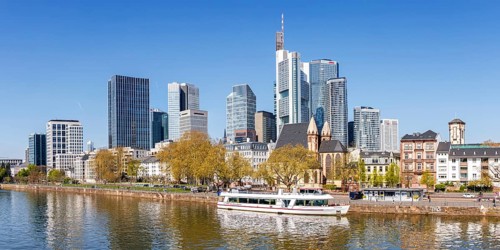 Frankfurt skyline skyscrapers with banks panorama at the river Main with excursion boat in