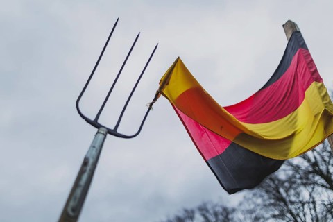 A pitchfork pierces the German flag, taken during the farmers' protests in Berlin, 15 January 2024.