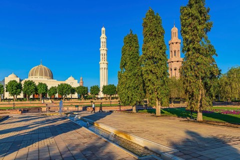 Park of the Sultan Qaboos Mosque, behind the mosque with the domes and minarets, Muscat, Arabian