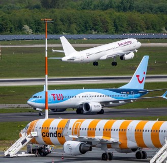 Eurowings aircraft takes off on Hauptbahn Süd, TUI Boeing 737 on taxiway, Condor flieger on apron,