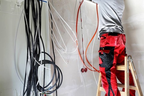 Professional electrical installation on a building shell