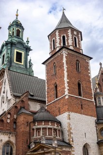 Krakow, Poland, 23.08.2025: Historic architecture in Krakow, Poland. Features a brick tower with a