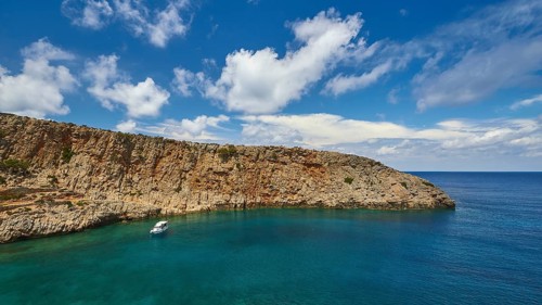 Menies, Rodopou, dream bay, pebble beach, single boat at anchor, crystal clear sea, green sea,