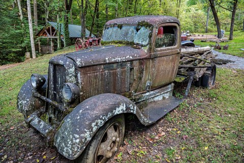 Moss covered antique Dodge truck at Ely's Mill along the Roaring Fork Motor Nature Trail outside