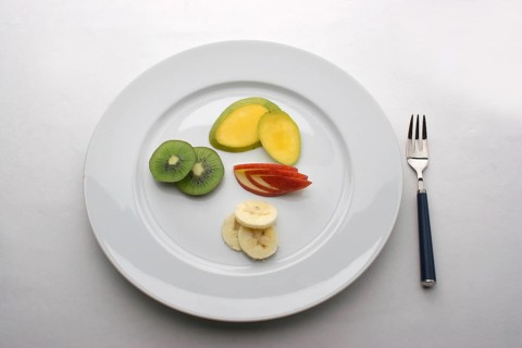 Fruit plate with kiwi, bananas, cucumbers
