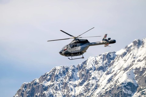Rescue helicopter, emergency medical helicopter in flight, Schwaz, Tyrol, Austria