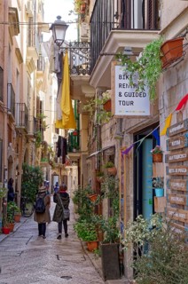 Colourful alley decorated with flowers in Bari Veccia, the old town of the southern Italian city of