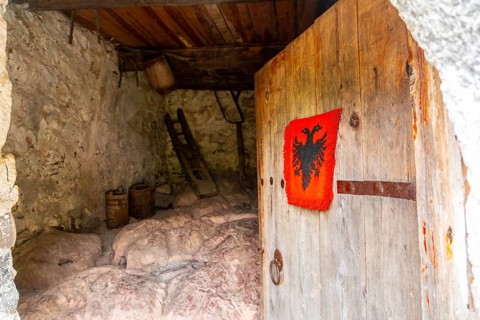 Entrance gate to Nikoll Koçeku tower in the valley of Theth national park, Albania. albanian alps