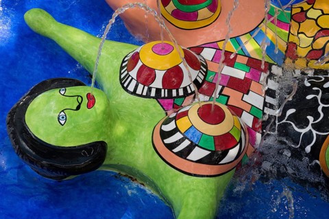 Woman lying down, Nana figure, colorful sculpture in a fountain, Giardino dei Tarocchi or Garden of