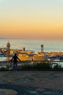 View of the old harbour and the city of Barcelona in the evening light, Spain