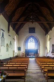 Light shining into east window of village parish church of Saint Andrew, Alderton, Suffolk,