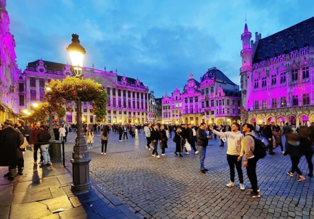People on the illuminated Grand-Place, Grote Markt, Brussels, Belgium