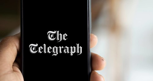 the telegraph logo is displayed on smartphone. The Telegraph is a British daily broadsheet