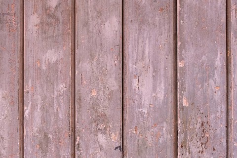 Old wooden door with peeling paint, texture, background, Apulia, Italy