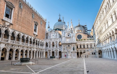 Inner courtyard of the Doge's Palace with giant staircase and St Mark's Basilica, Venice, Veneto,